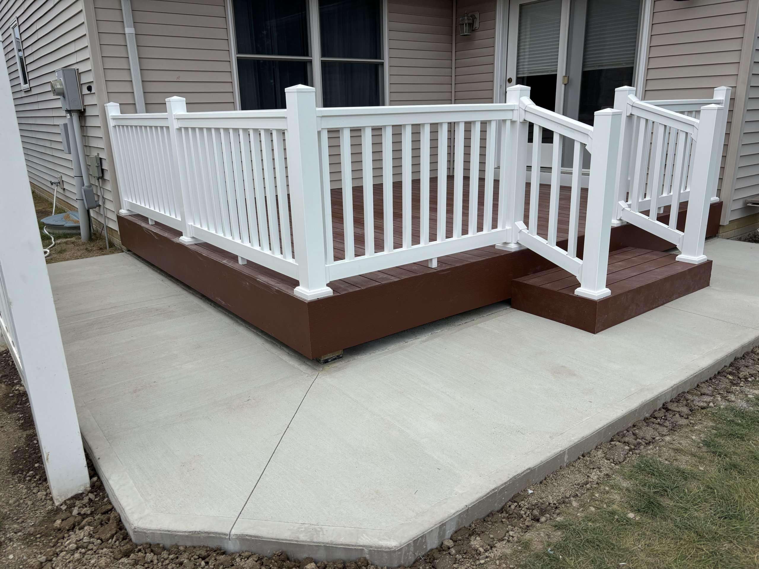 12 x 14 Composite Deck Construction (UltraDeck Fusion 2.0) & Concrete Pad Extension – Bryan, Ohio